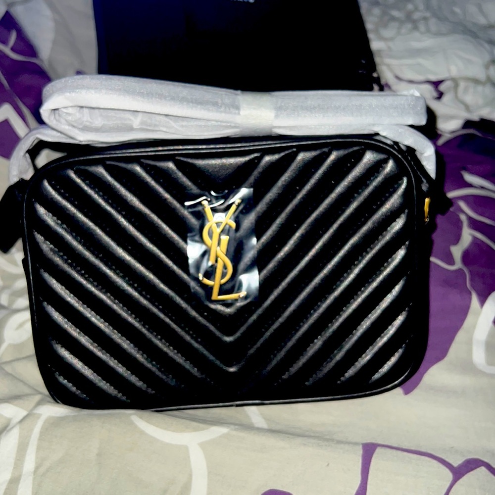 LOU CAMERA BAG IN QUILTED LEATHER
SAINT LAURENT MONOGRAM SHOULDER BAG FEATURING